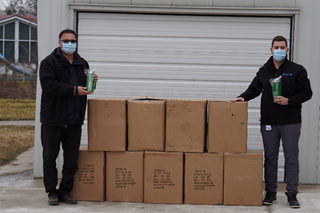  (L-R) Americo Todino, Principal of Monsignor Uyen Catholic School accepts the donation of 450 water bottles from Jake Zelina, CK Public Health.