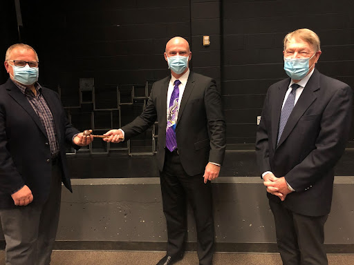 In the photo – Director of Education Scott Johnson (centre) presents the gavel to Chair of the Board John Van Heck (left) as Vice Chair Mat Roop looks on, following the Initial Meeting of the Board for the 2022 term.